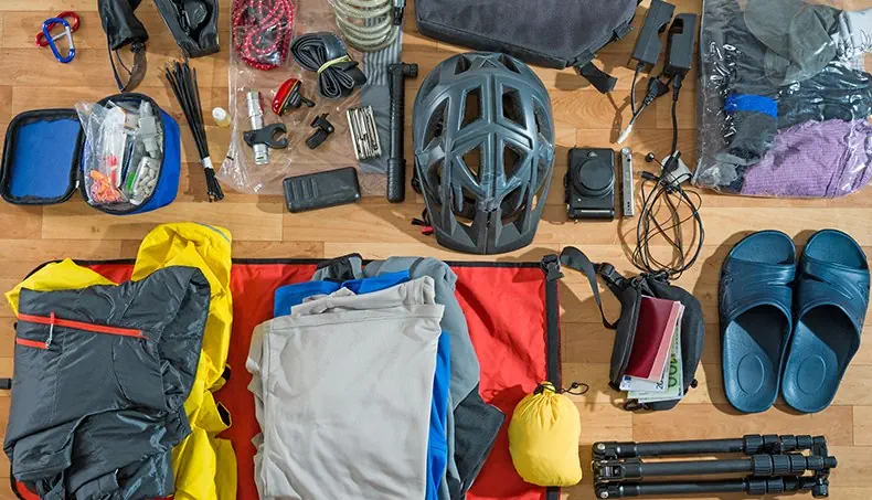 AID KIT, CARABINER, HELMET, CAMERA, FLIP-FLOPS