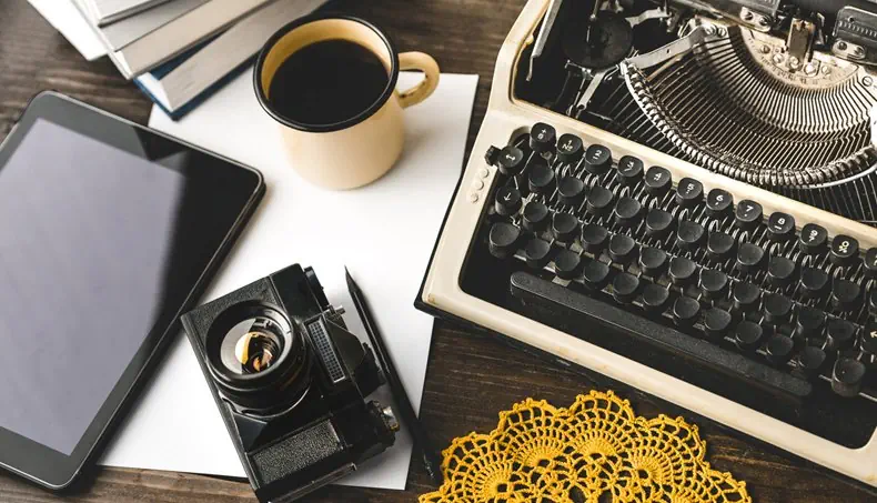CAMERA, TABLET, COFFEE, BOOKS, TYPEWRITER