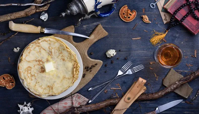 PANCAKES, KNIFE, CUTTING BOARD, BRANCH, ROSARY