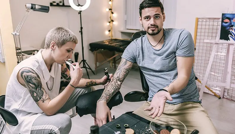 TATTOOIST, TATTOO, CUSTOMER, COOKIE, HAIRSTYLE