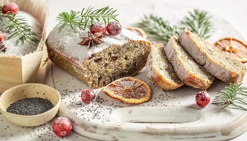 FRUITCAKE, POPPY SEEDS, CUTTING BOARD, STAR ANISE, CRANBERRY