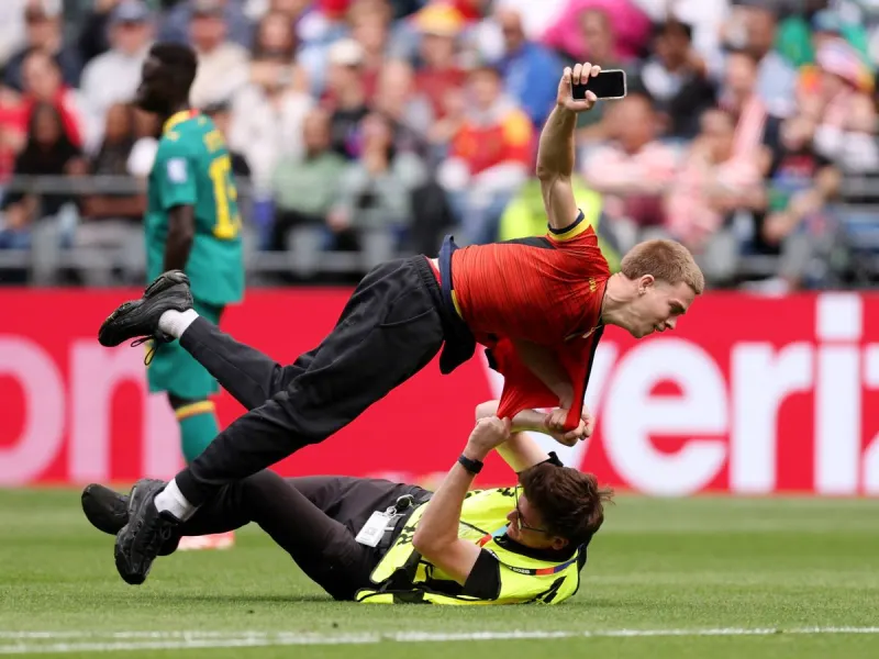 World Cup match stopped as three protesters wrestled and removed from pitch