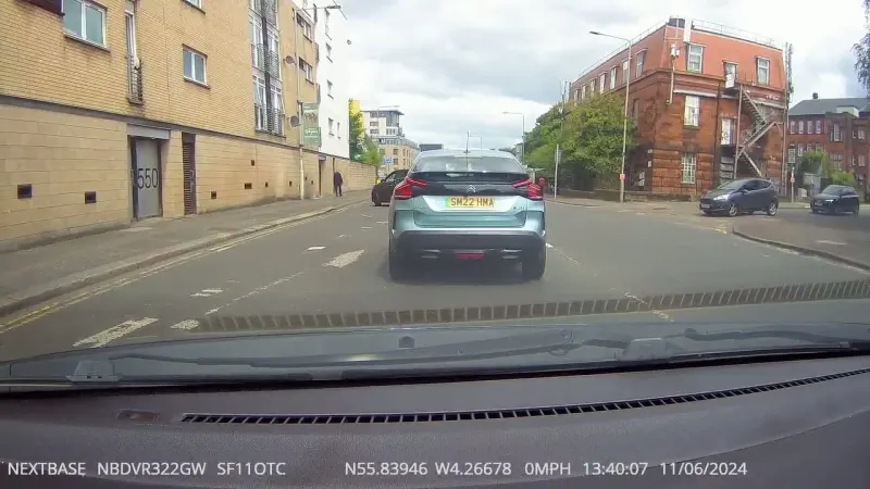 Shocking footage shows woman thrown from motorbike onto car window in Glasgow crash